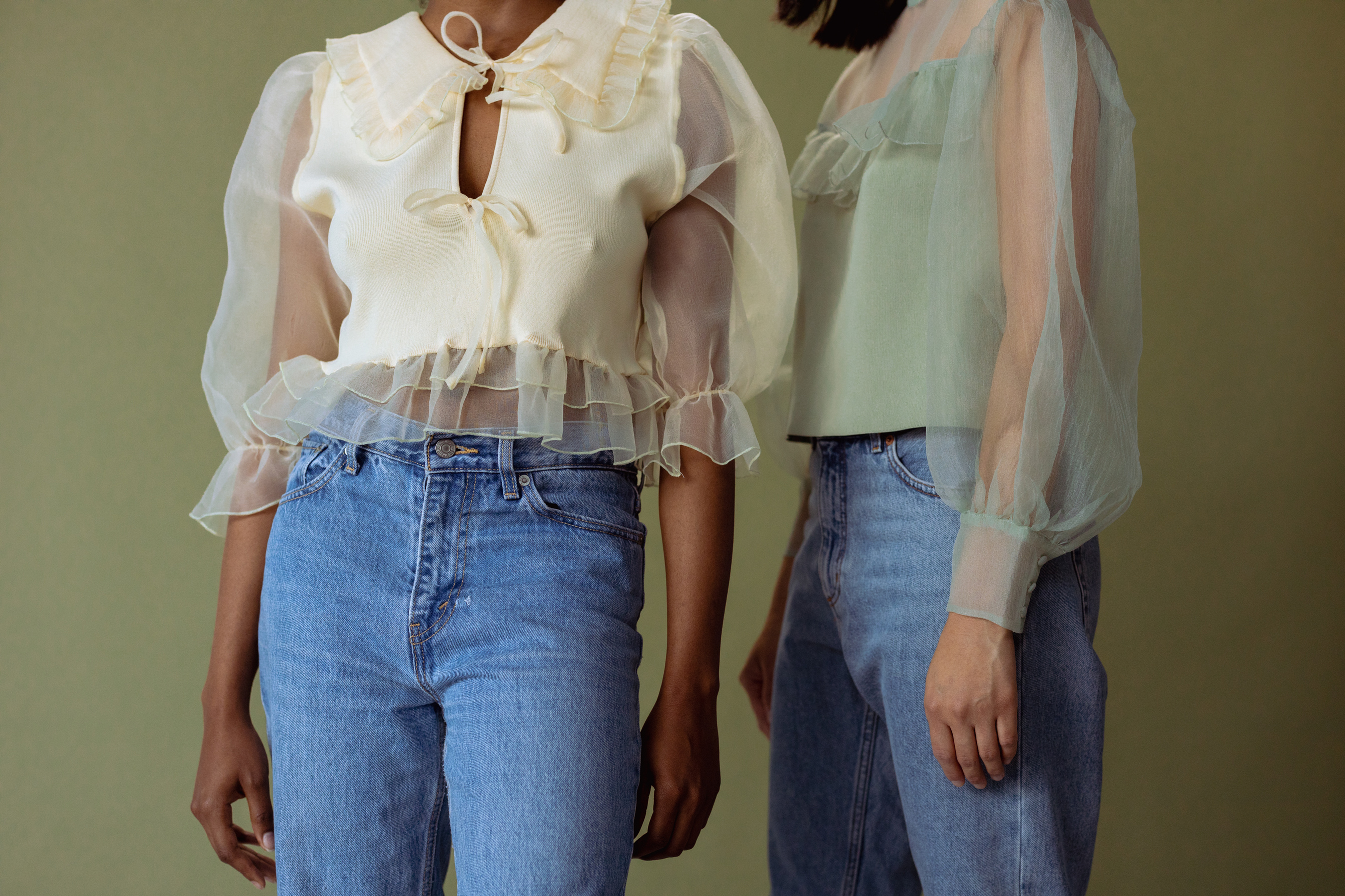 Women Wearing Chiffon Crop Top and Blue Denim Jeans